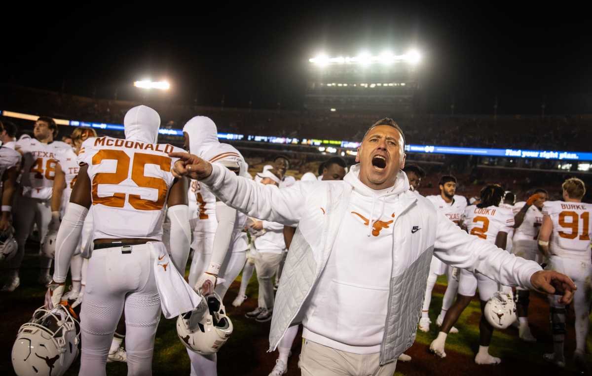 Texas head coach Steve Sarkisian celebrates after a win 